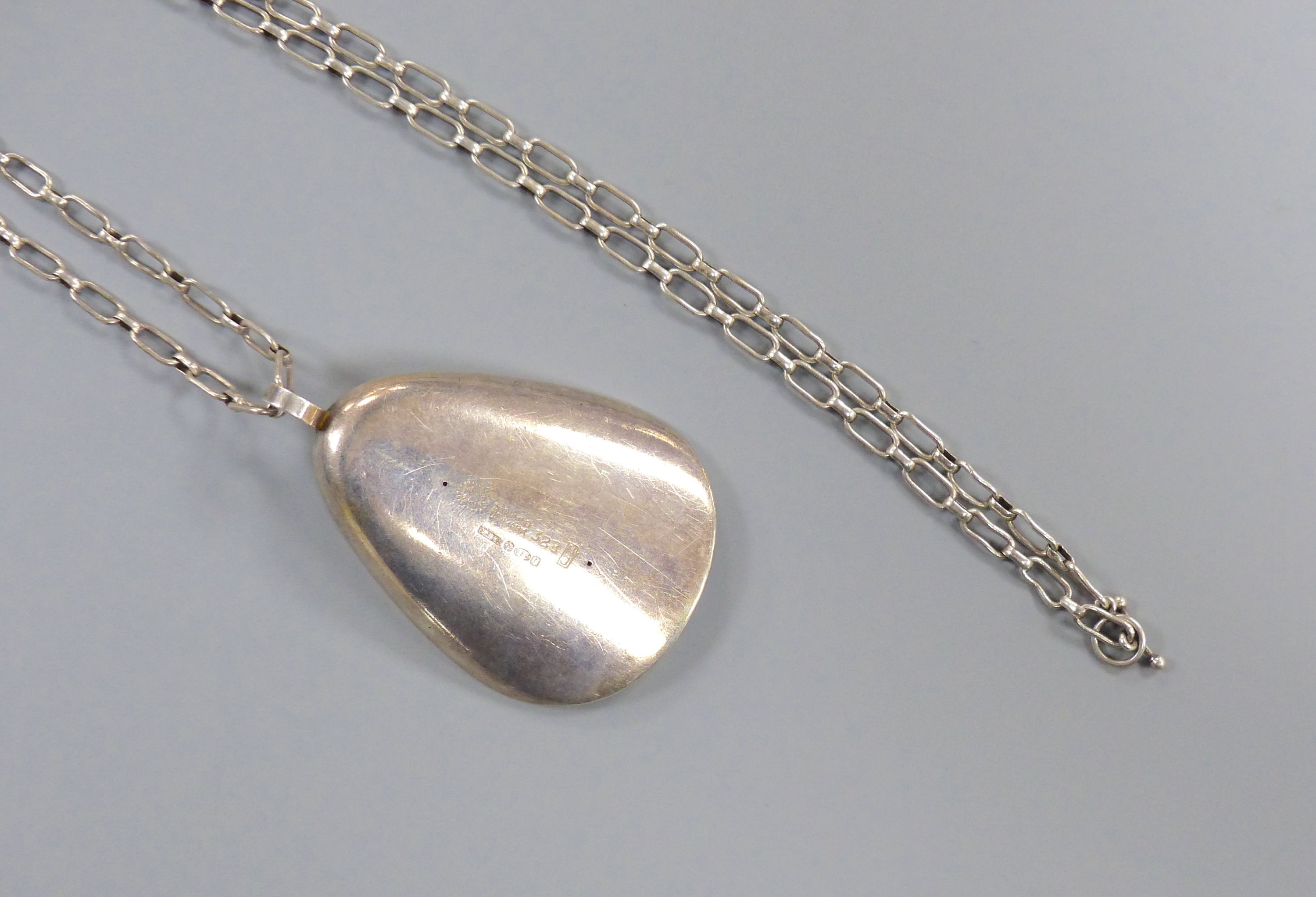A 1960's Nanna & Jorgen Ditzel for Georg Jensen sterling oyster shell pendant, 60mm, design no 328, on a white metal chain, 84cm